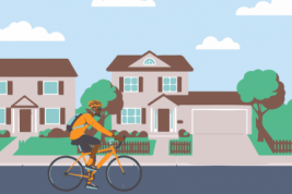image of cyclist riding in neighborhood